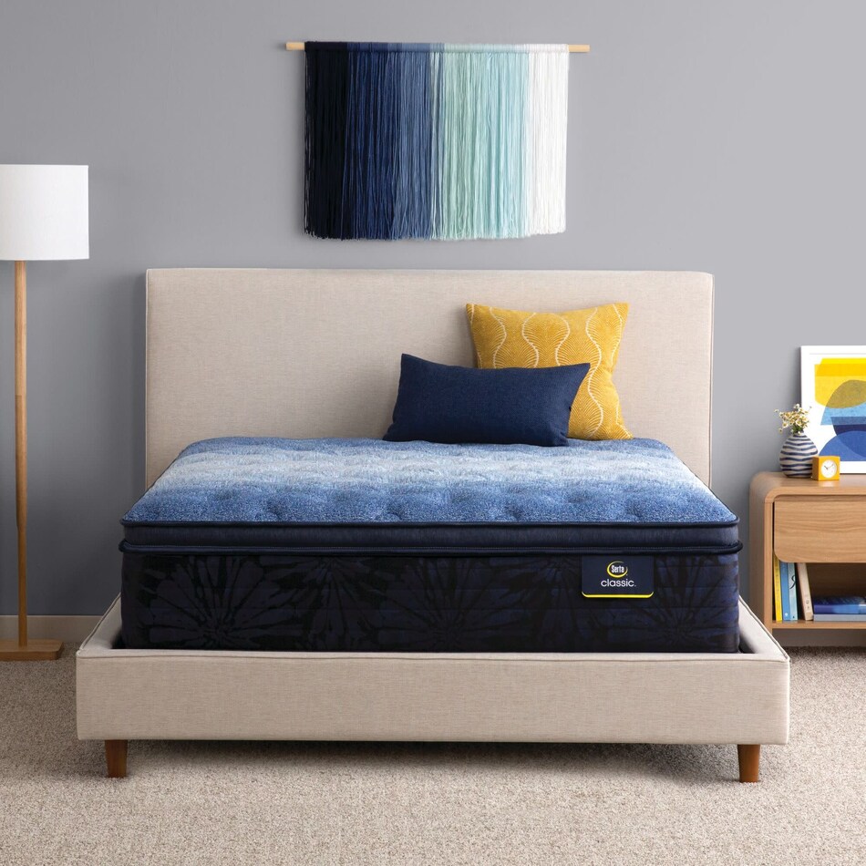 top color: multicolor side color: off white accent color: dark blue bedding   